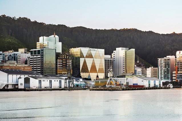 The ever-changing permutations of XXCQ’s façade reflect off the peaceful waters 
of the capital.