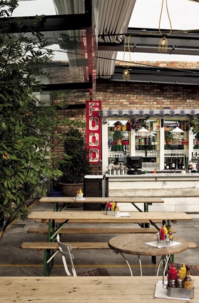 Bavarian beer-hall tables, industrial lighting and a retractable roof imported from Italy are key ingredients of the courtyard.
