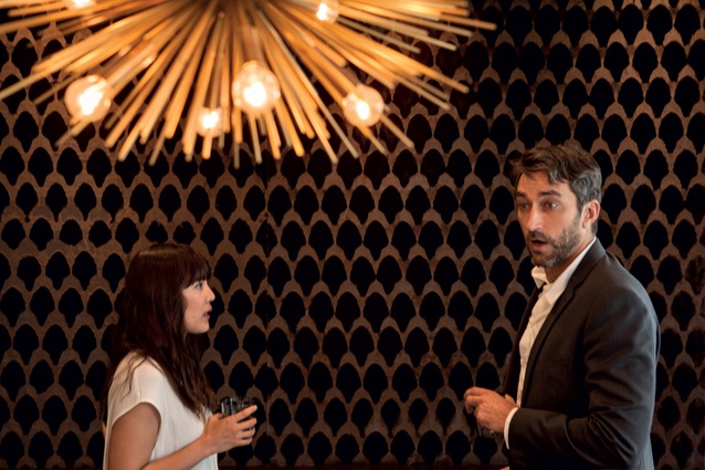 The private dining room also features a textured fabric wall covering.