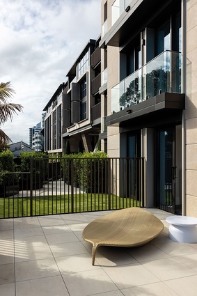 Perforated screens, louvres and aluminium fins regulate light and airflow and provide a degree of privacy.