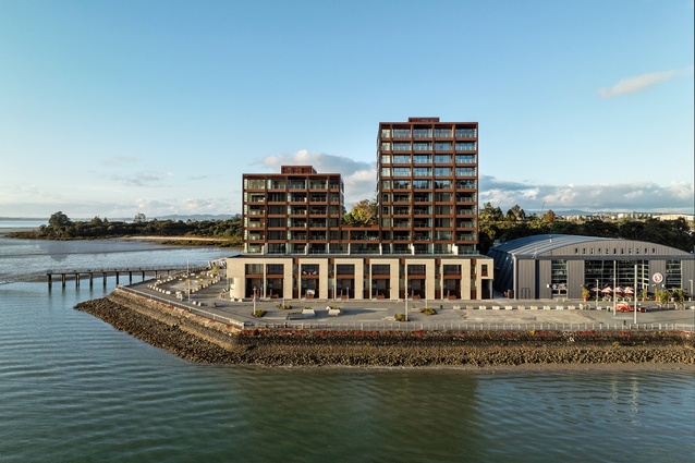 The two-level wharf terraces are aligned with the height of the Sunderland Hangar doors. Hangar doors. The courtyard apartments look over the top of the terraces.