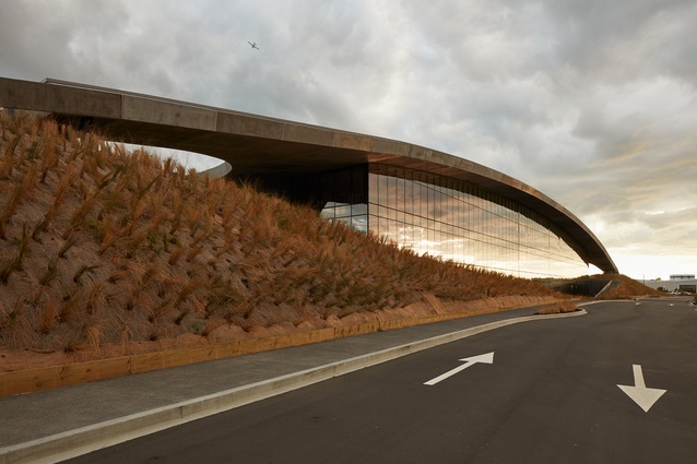From the car park, the concrete arch may seem vast and hangar-like, but it is smaller than it looks and more resonant of its context near the shoreline of our volcanic isthmus.