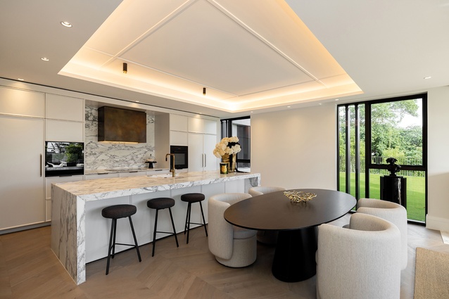 Coffered ceilings maximise the apartments’ floor-to-floor height, with services pushed to the perimeter.