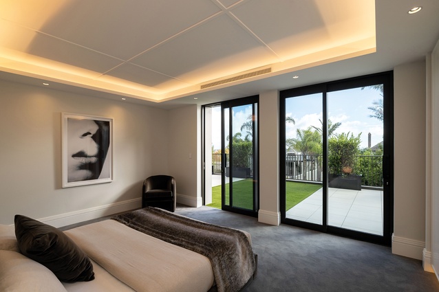 Coffered ceilings maximise the apartments’ floor-to-floor height, with services pushed to the perimeter.