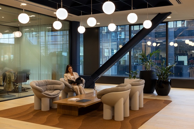 The ceiling system in Dentons’ reception area  enabled the designers to accommodate a high level of bespoke detailing.